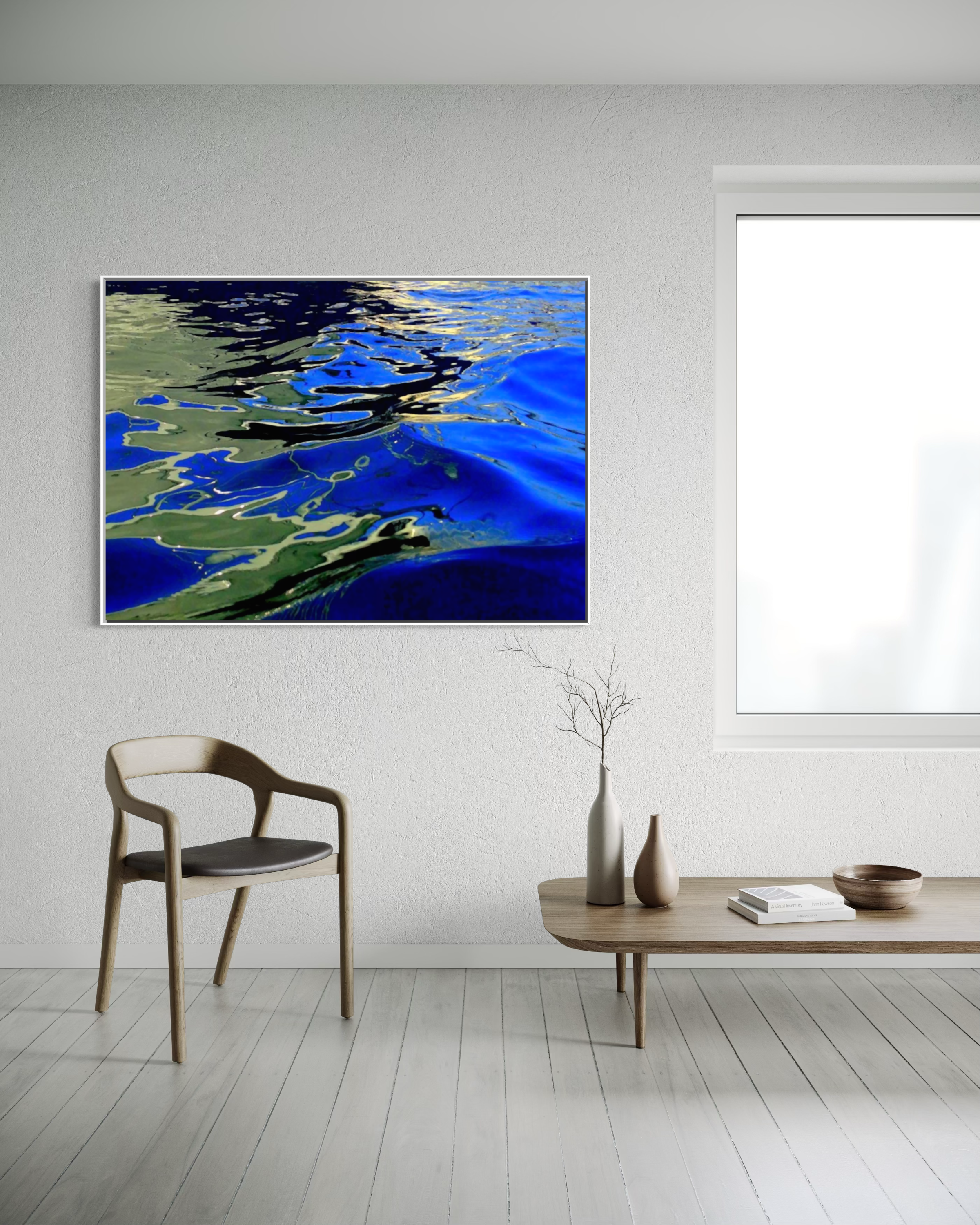 Blue Green Water by Ralph Kerle positioned in a sleek modern living space with understated décor, creating a strong visual contrast against the crisp white walls