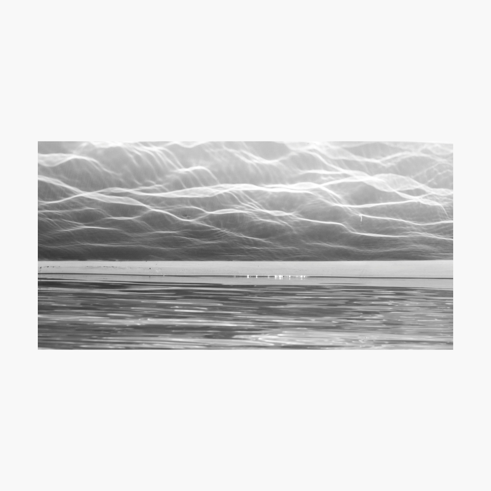 City of Light artwork by Ralph Kerle showing a monochrome abstract waterscape with flowing reflections and luminous wave patterns.
