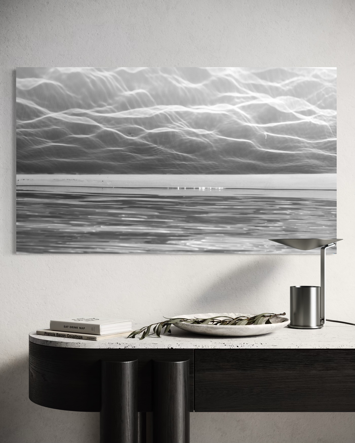 City of Light artwork displayed above a console in a modern interior with soft neutral colours and reflective surfaces.