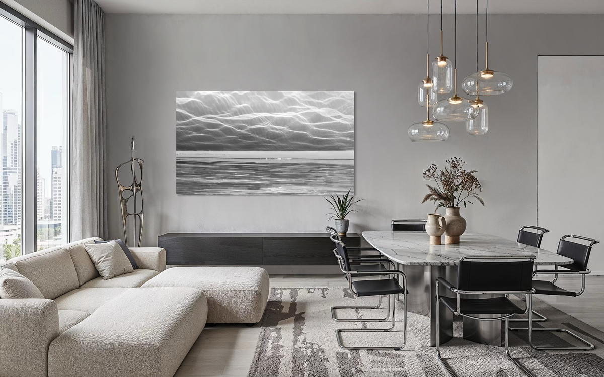 City of Light artwork displayed in a modern dining area with minimalist furniture and a bright open interior.
