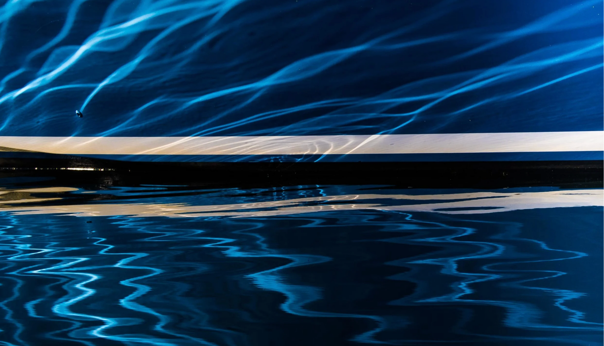 Blue abstract light pattern on a dark background