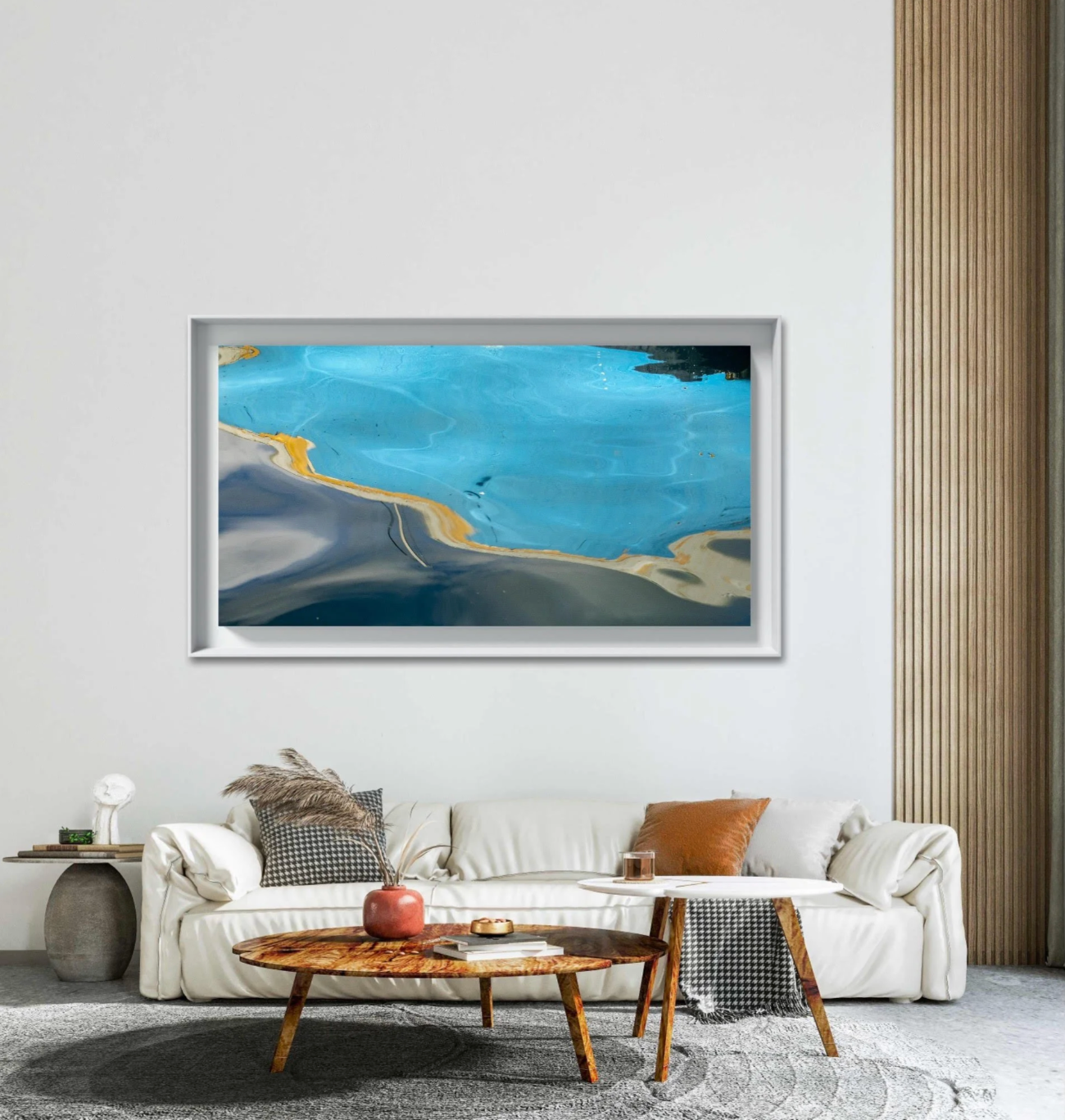 Offshore Aloft by Ralph Kerle positioned above a sofa in a warm, lived-in living space with layered textiles and decorative accents that balance the bold colours of the painting