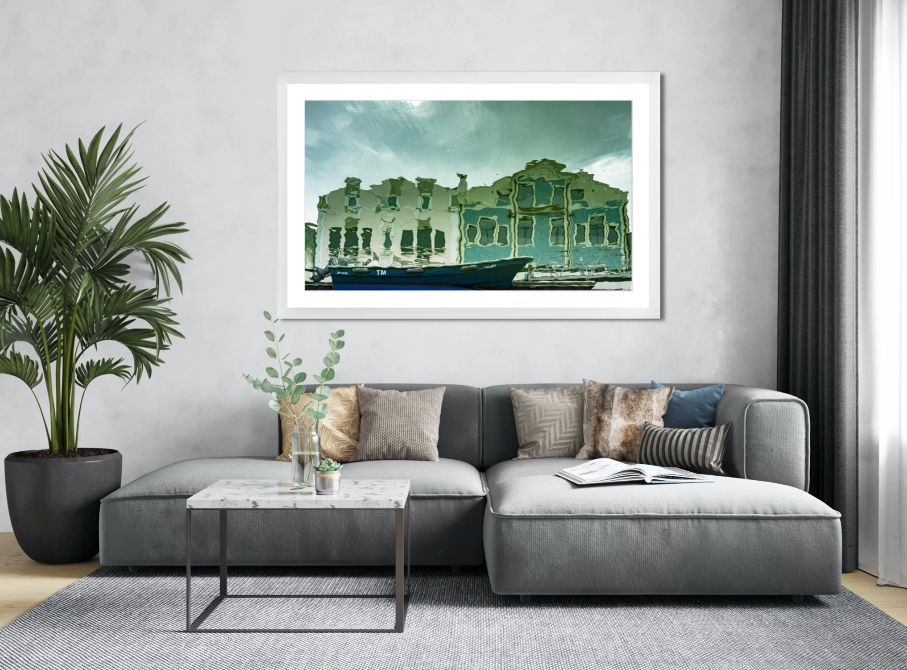 The Green Houses by Ralph Kerle hanging in a comfortable living room with soft furnishings, cool textures, and natural lighting that complements the calming tones of the artwork