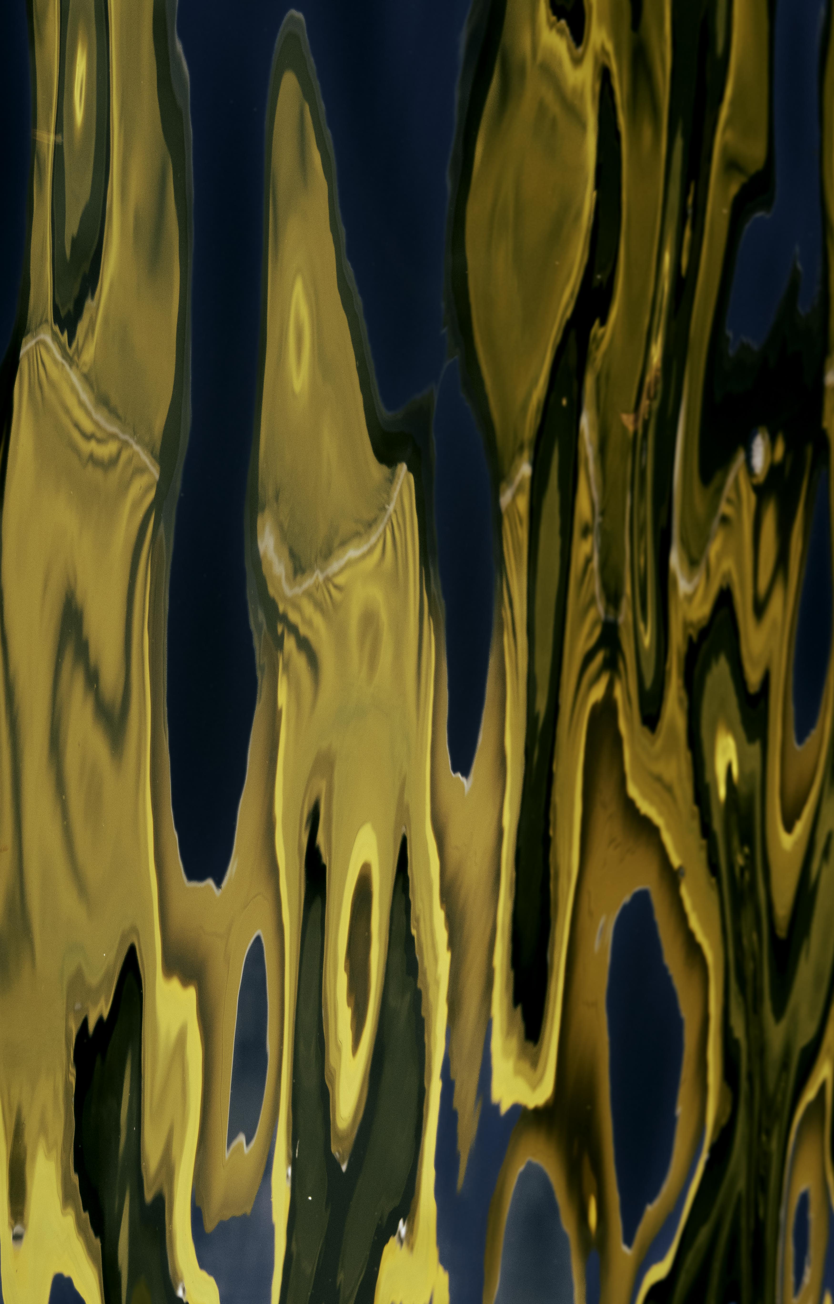 Abstract design with gold and blue colors on a dark background
