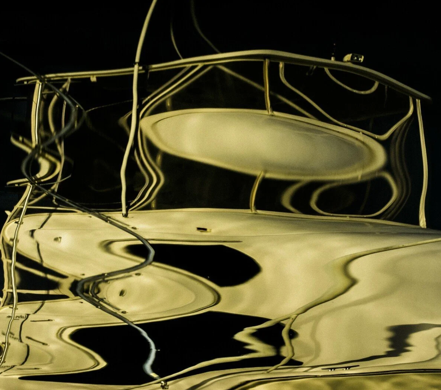 Abstract reflection of a boat on water with a dark background